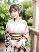 A woman in a kimono posing for a picture.